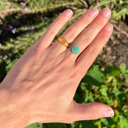 A pear shaped green turquoise stone from Royston Mining District in Nevada.