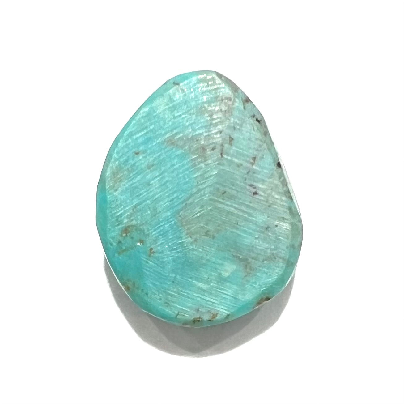 A loose, freeform pear shaped Pilot Mountain turquoise stone from Nevada.