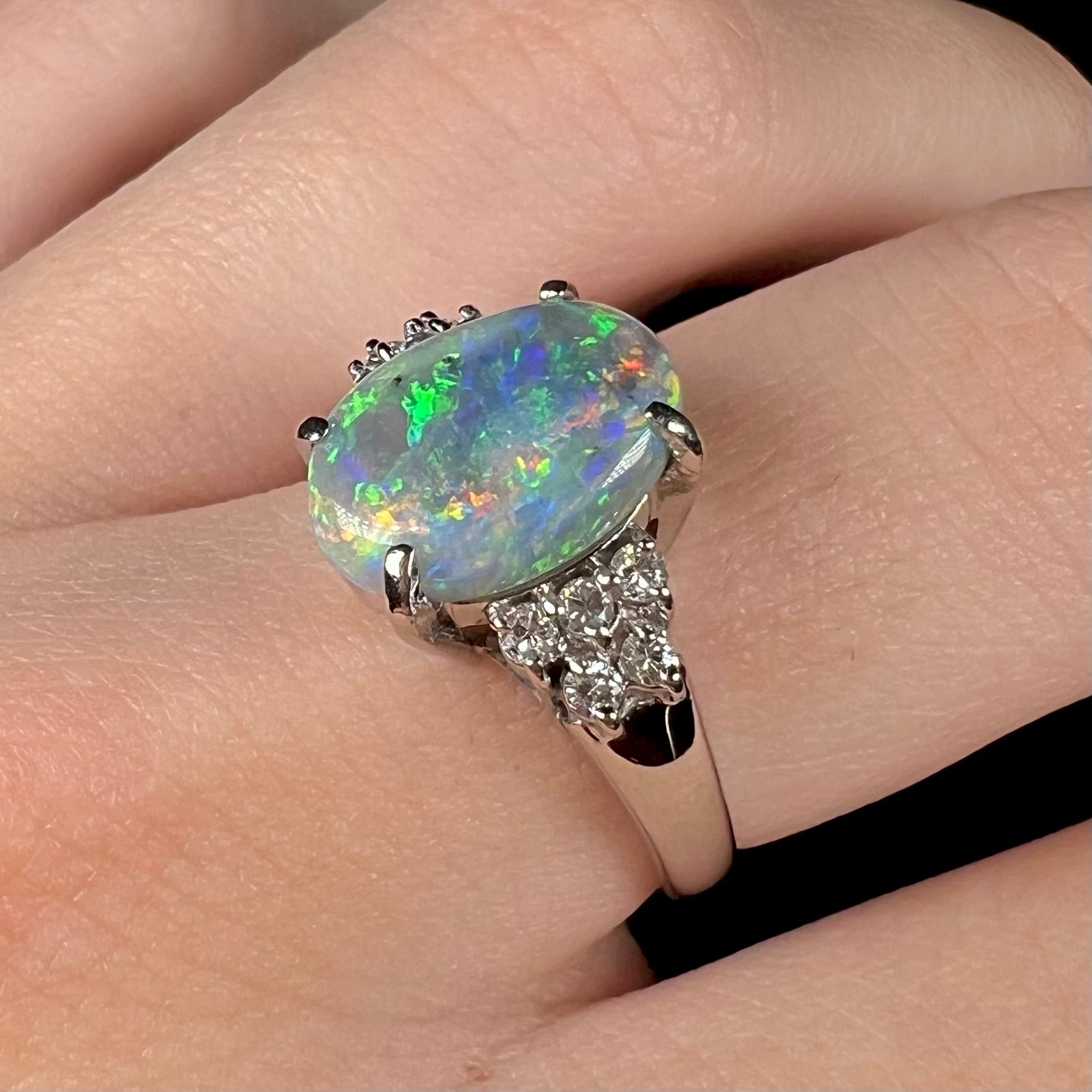 A multicolor Lightning Ridge opal and diamond-accented ring in platinum.