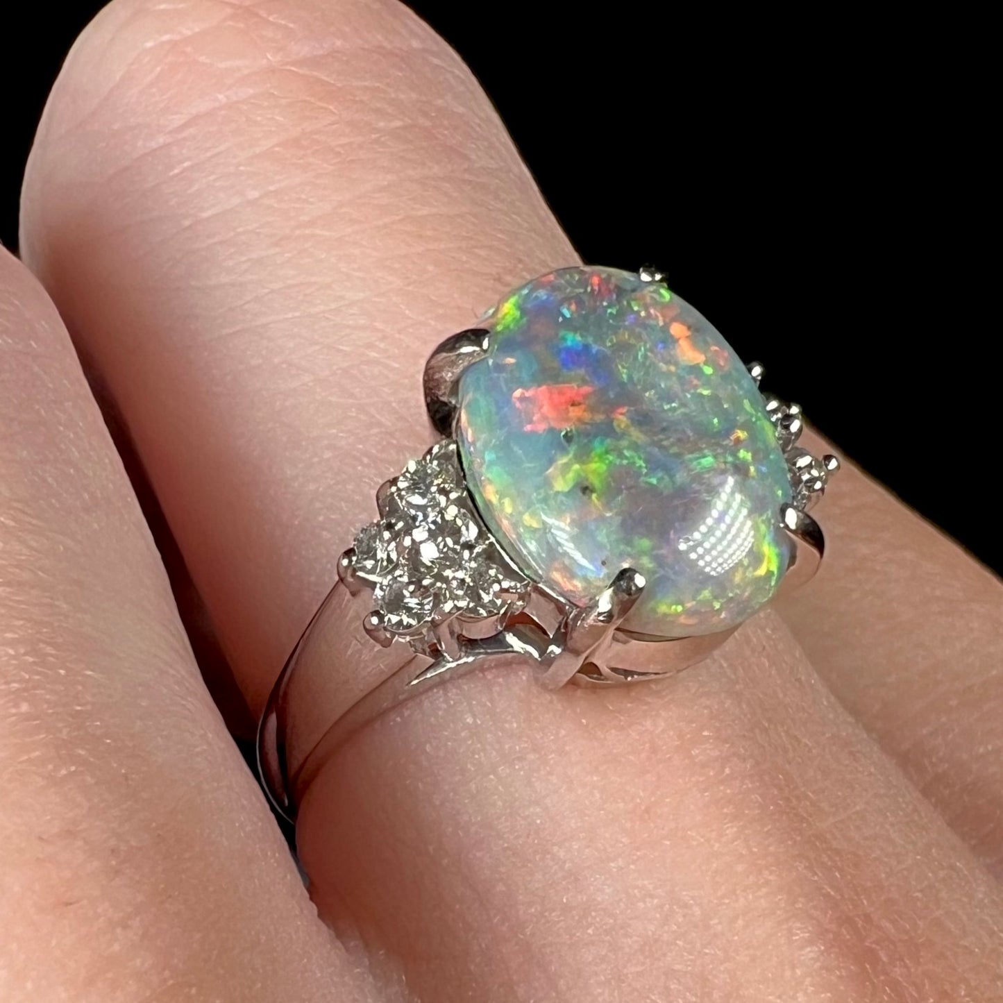 A multicolor Lightning Ridge opal and diamond-accented ring in platinum.