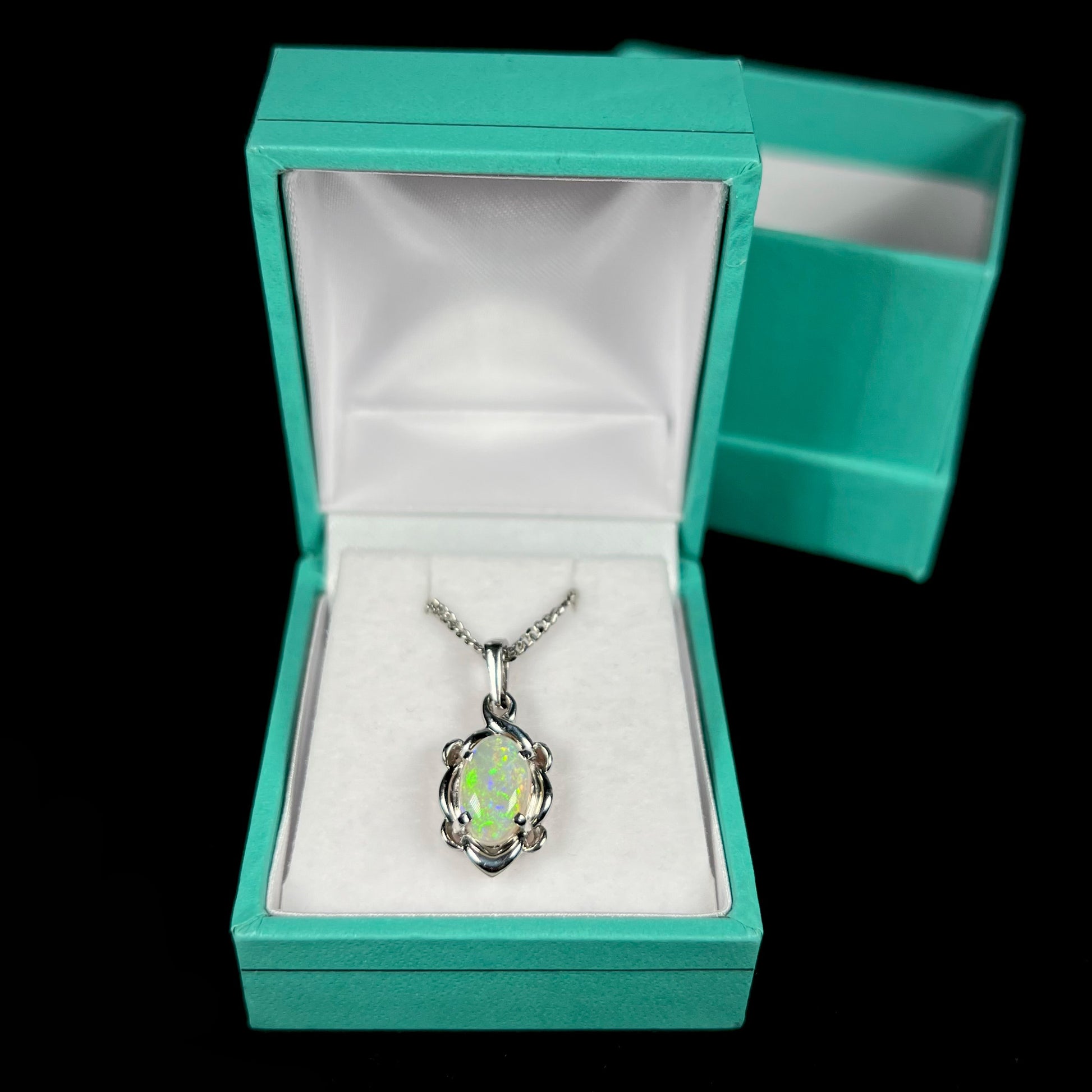 A platinum opal necklace on a platinum chain.  The opal weighs 1.49ct and has predominantly green color play.