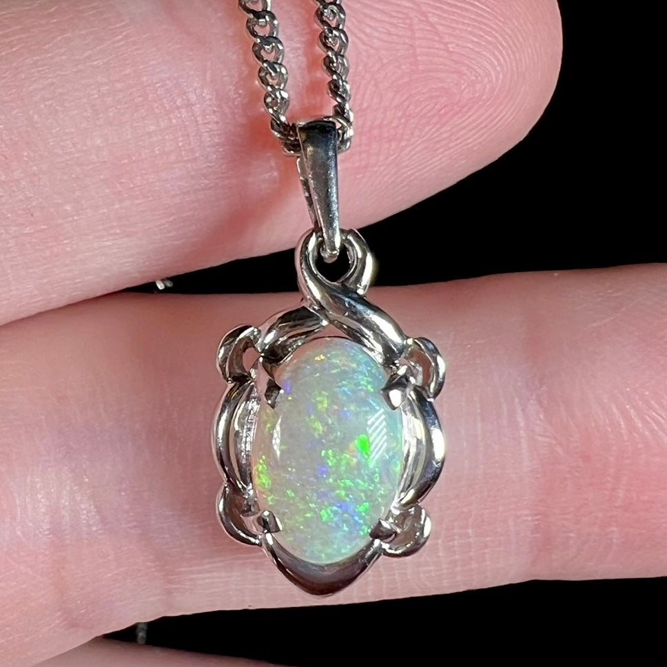 A platinum opal necklace on a platinum chain.  The opal weighs 1.49ct and has predominantly green color play.