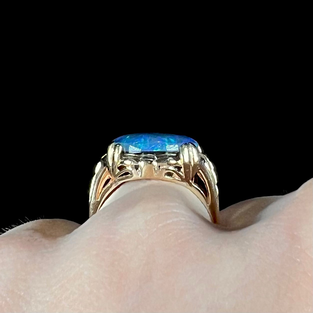 A ladies' vintage, 1940's style black opal doublet ring in yellow gold.