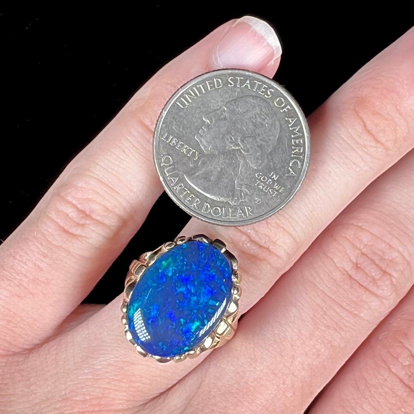 A ladies' vintage, 1940's style black opal doublet ring in yellow gold.