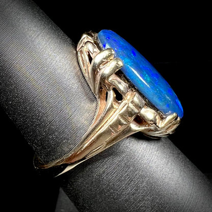 A ladies' vintage, 1940's style black opal doublet ring in yellow gold.