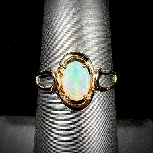 A 14 karat yellow gold open-shank design Australian crystal opal ring.