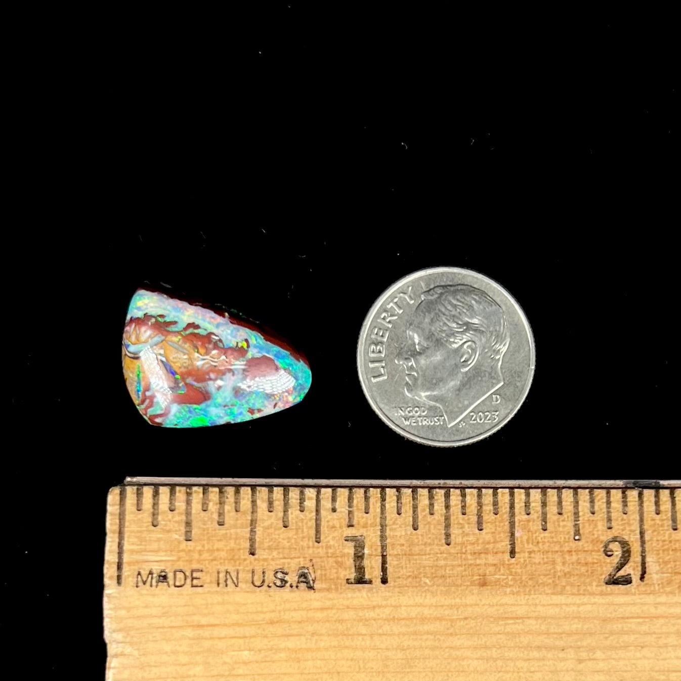 A polished matrix opal stone from Koroit, Australia.  The opal has a blue color.