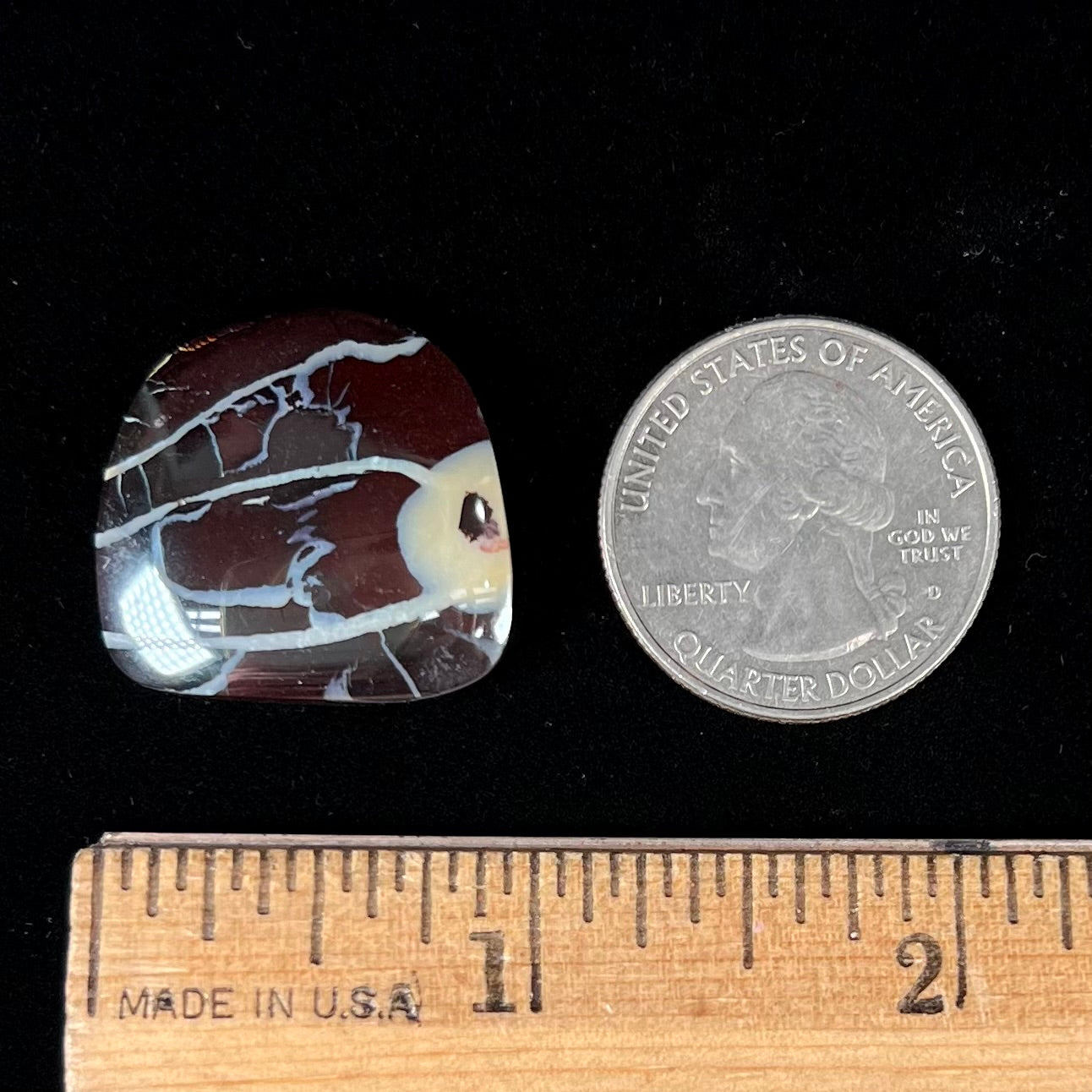 A polsihed, freeform Yowah nut opal specimen.  The stone is ironstone with common opal potch inclusions.