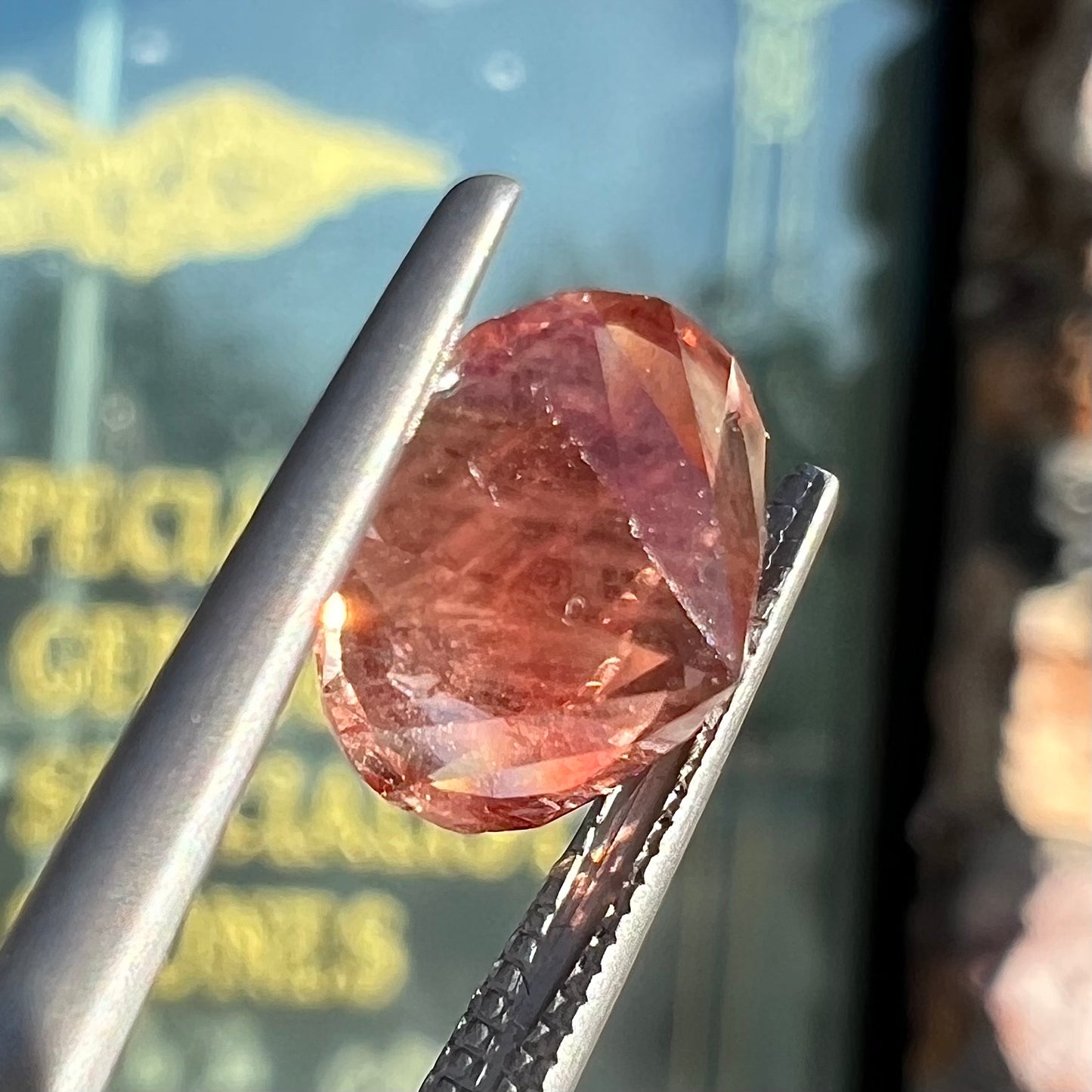 A loose, round brilliant cut Oregon sunstone gem.