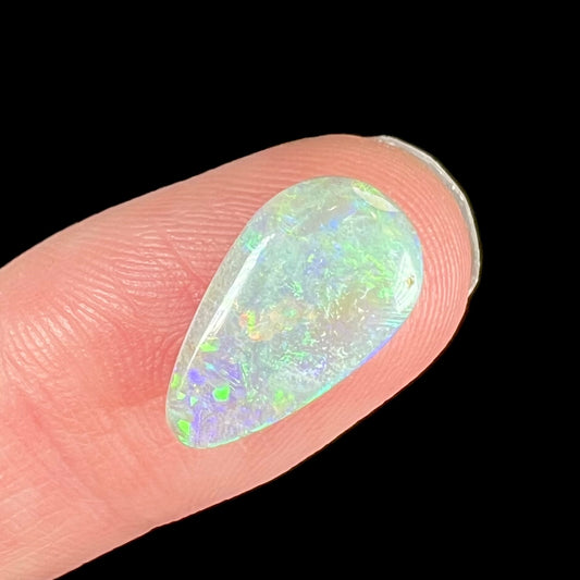 A pear shaped light opal stone from Lightning Ridge, Australia.