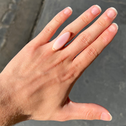 A loose, marquise cabochon cut pink common opal from Peru.  The opal has no play of color.