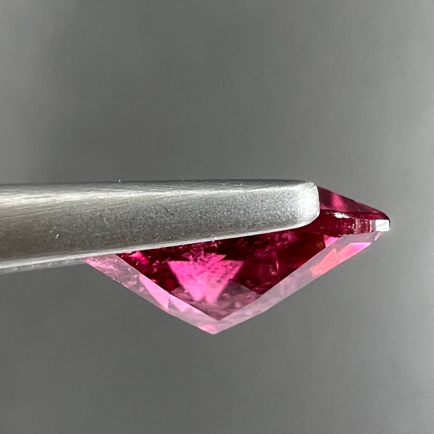 A trillion cut pink tourmaline gemstone.
