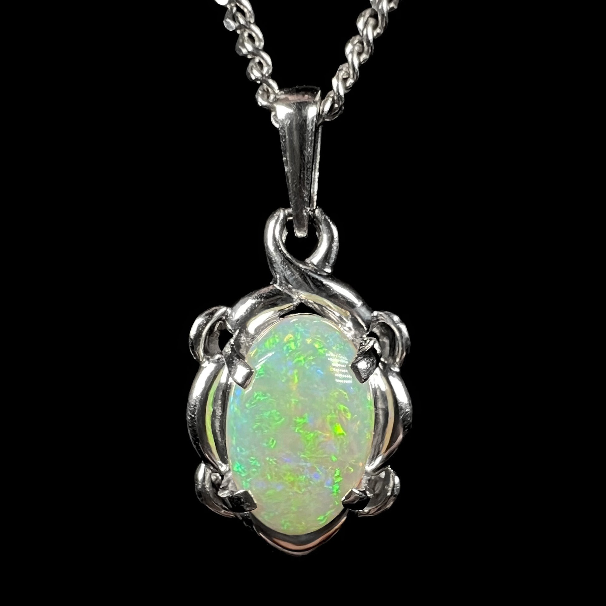 A platinum opal necklace on a platinum chain.  The opal weighs 1.49ct and has predominantly green color play.