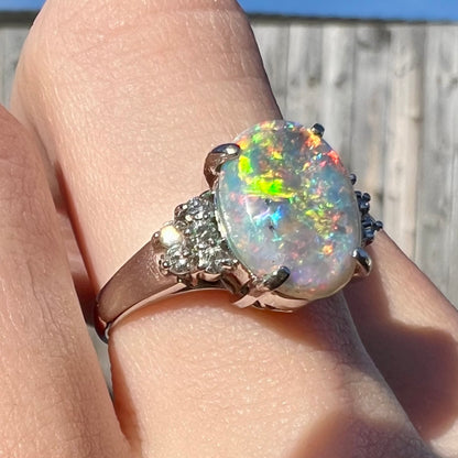 A multicolor Lightning Ridge opal and diamond-accented ring in platinum.