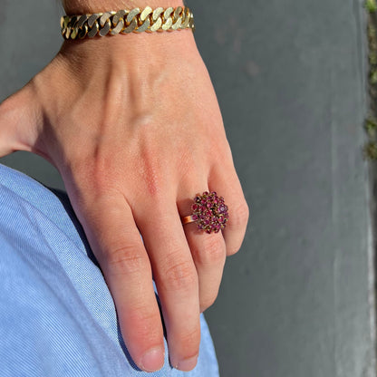 A ladies' vintage Thai princess ring set with round cut purplish red rubies.