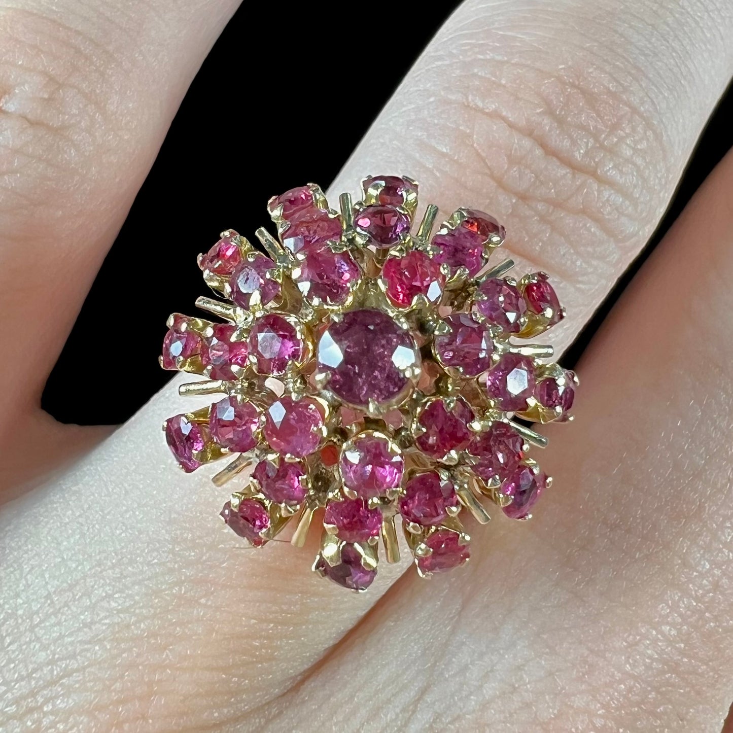 A ladies' vintage Thai princess ring set with round cut purplish red rubies.