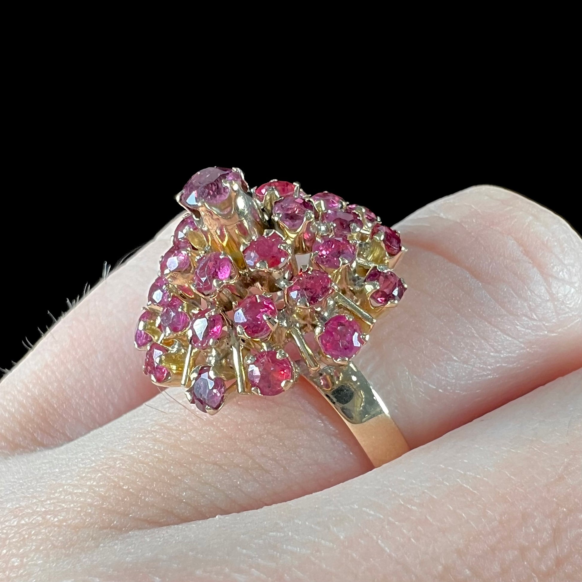 A ladies' vintage Thai princess ring set with round cut purplish red rubies.