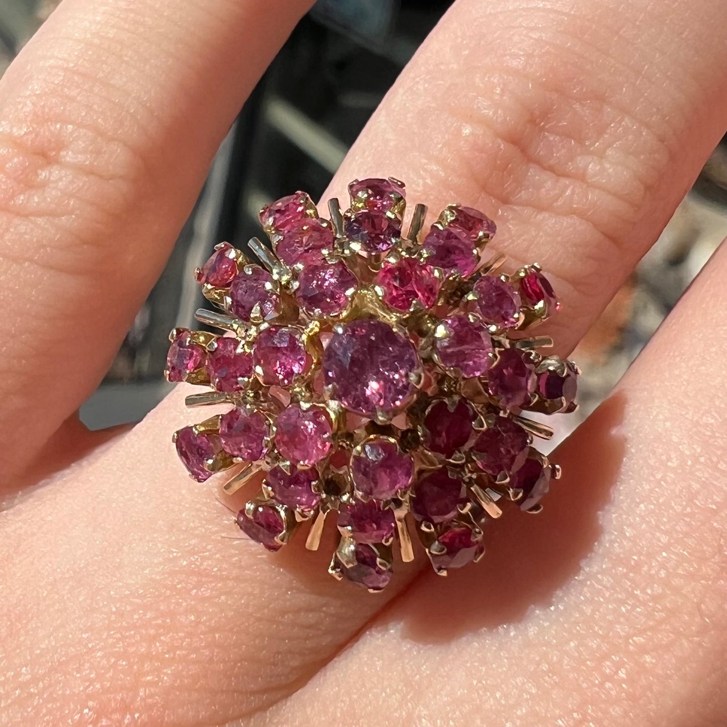 A ladies' vintage Thai princess ring set with round cut purplish red rubies.