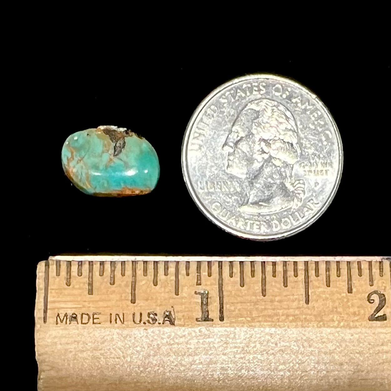 A loose, greenish blue Royston turquoise stone from Nevada.  The stone has brown and black matrix.