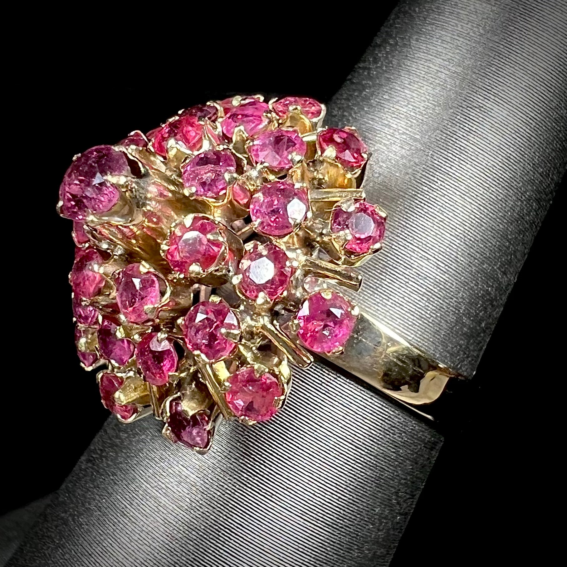 A ladies' vintage Thai princess ring set with round cut purplish red rubies.