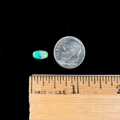 A loose, semi-crystal opal from Australia.  The opal predominantly show green and orange colors.