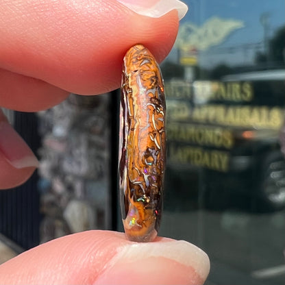 The ironstone side of a Yowah nut boulder opal.