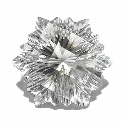 A fantasy snowflake cut white topaz gemstone.