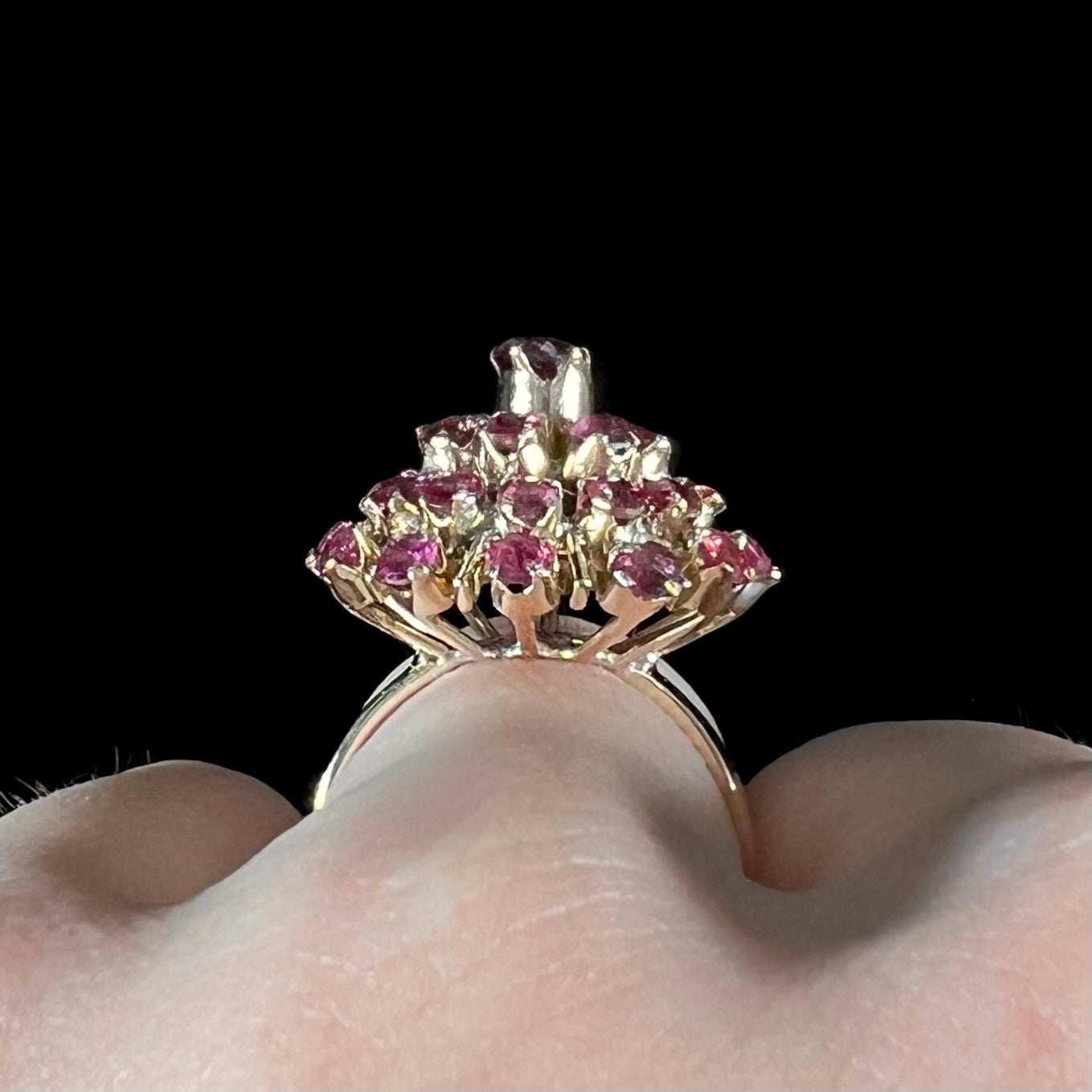 A ladies' vintage Thai princess ring set with round cut purplish red rubies.