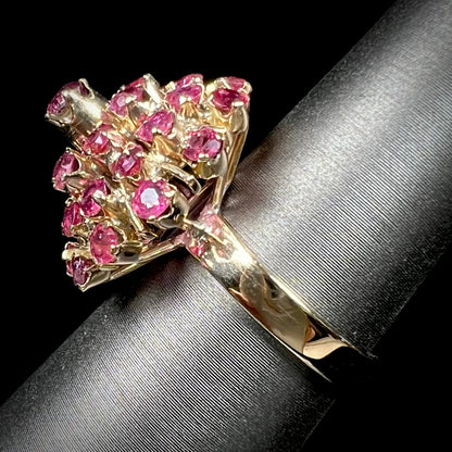 A ladies' vintage Thai princess ring set with round cut purplish red rubies.