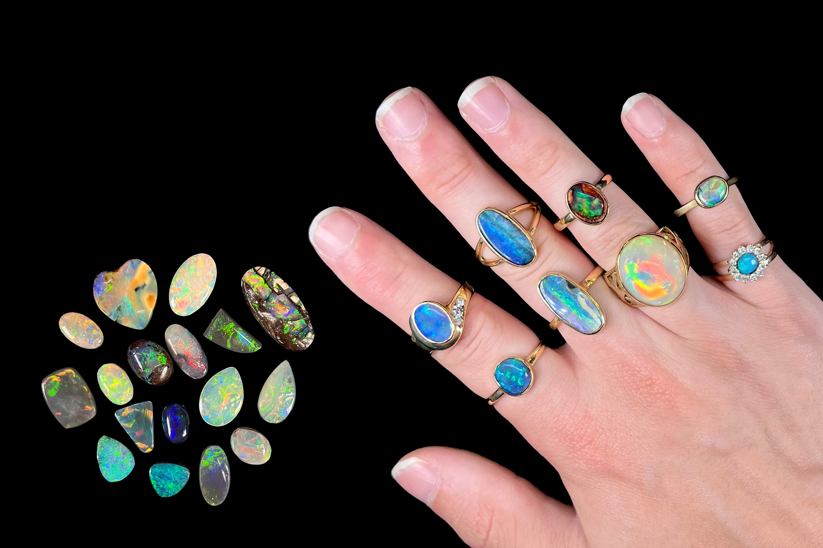 A hand wearing eight different opal rings, next to a pile of cut loose opals.