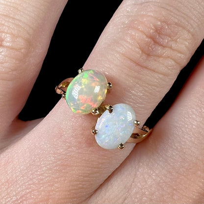 A yellow gold ring mounted with an Ethiopian fire opal and a Coober Pedy, Australian opal.