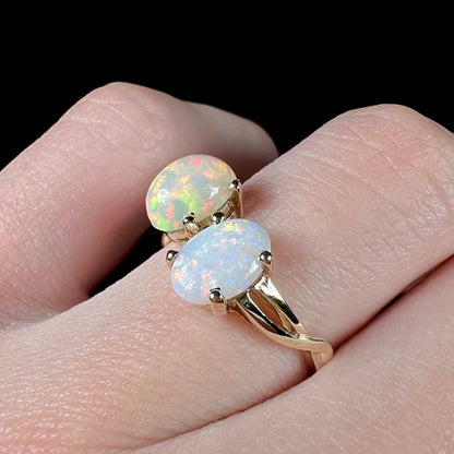 A yellow gold ring mounted with an Ethiopian fire opal and a Coober Pedy, Australian opal.