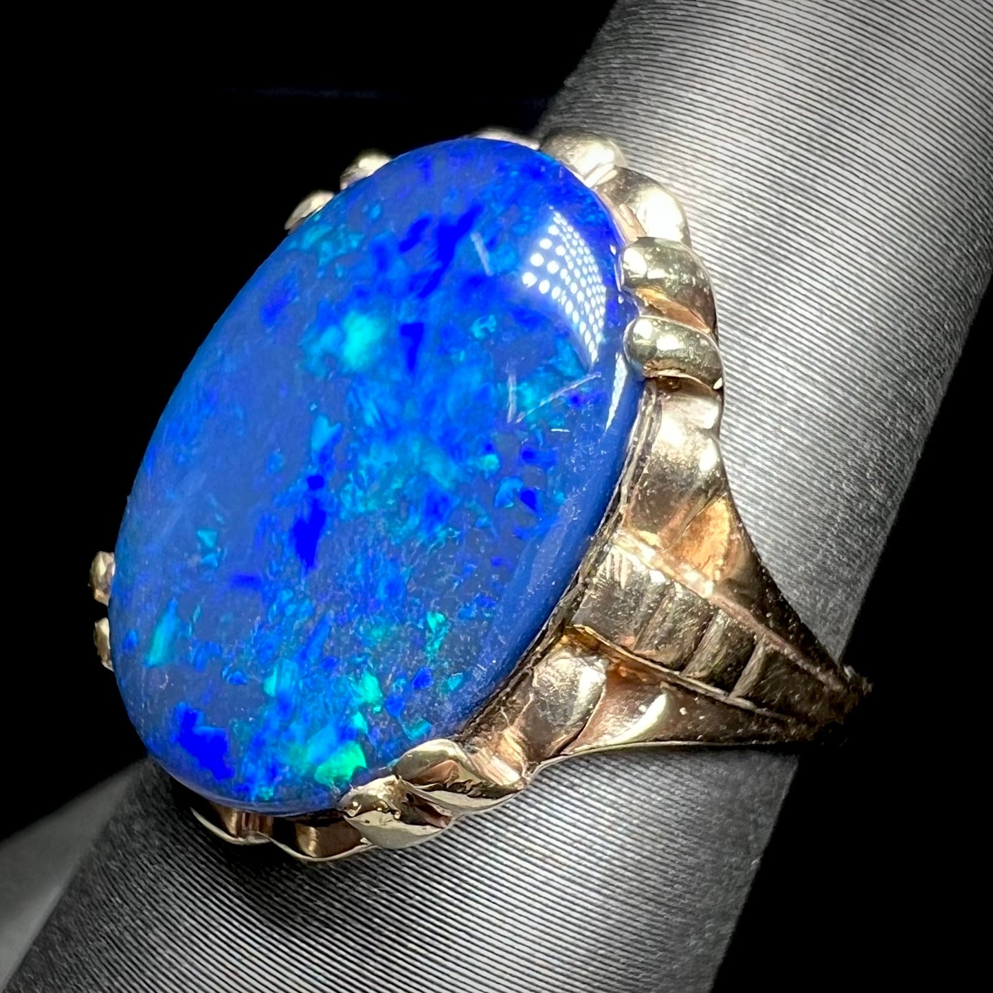 A ladies' vintage, 1940's style black opal doublet ring in yellow gold.