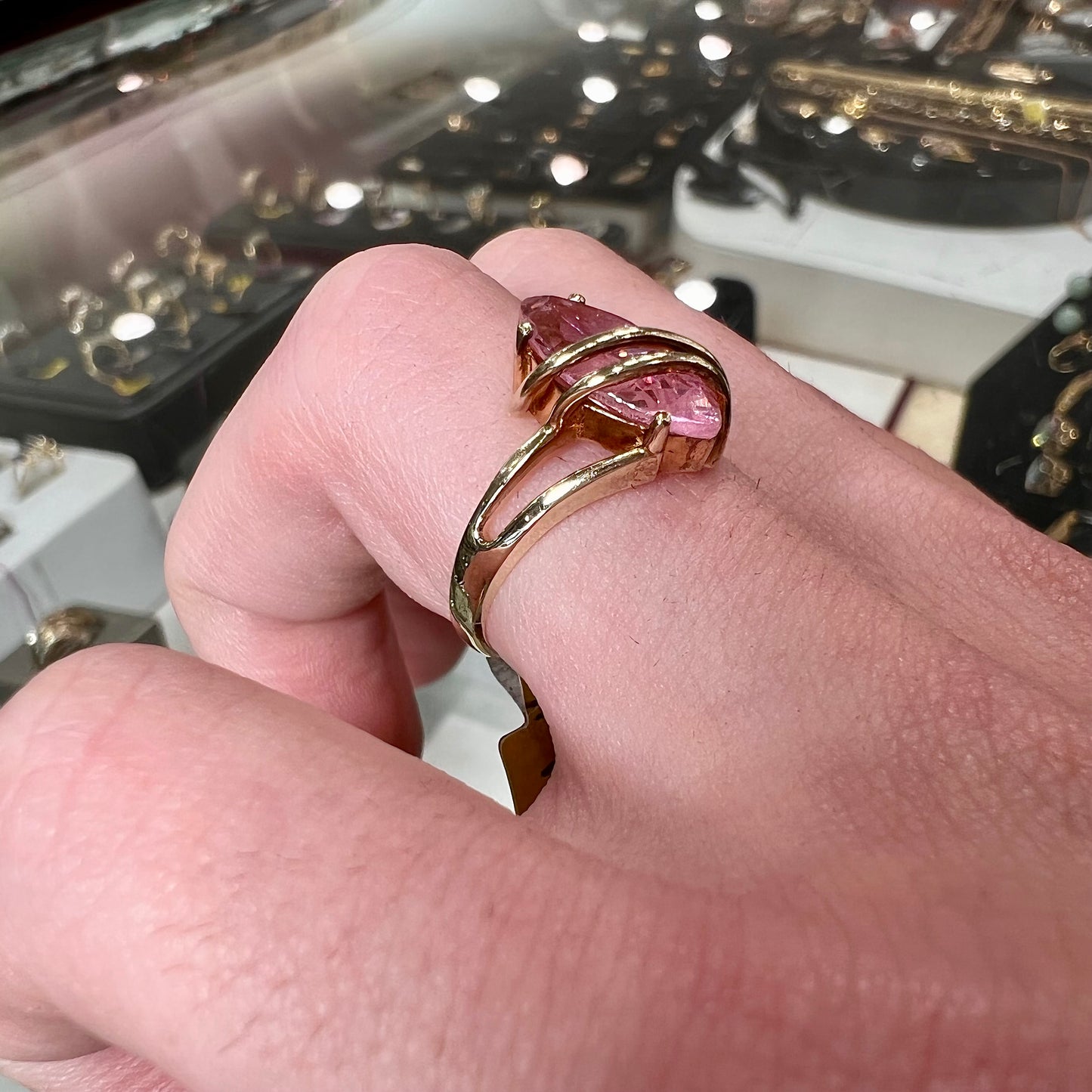 A yellow gold marquise cut pink cubic zirconia ring.