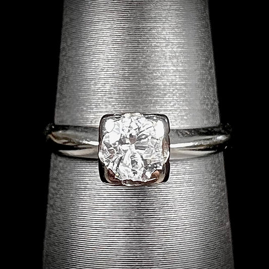 A ladies' vintage 14kt white gold 1940's diamond solitaire ring.  The diamond is chipped in two places.