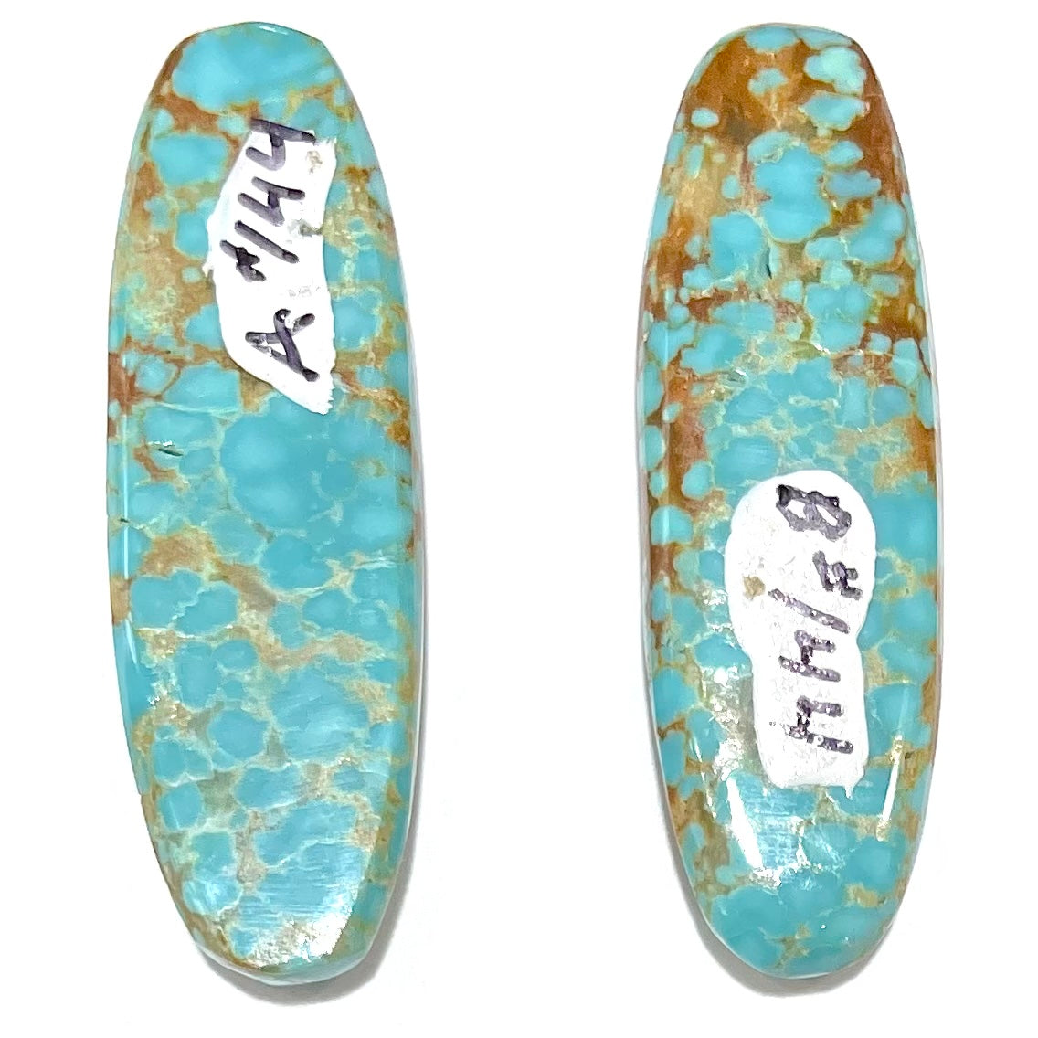 A pair of loose oval cabochon cut turquoise stones from Number 8 Mine, Nevada.