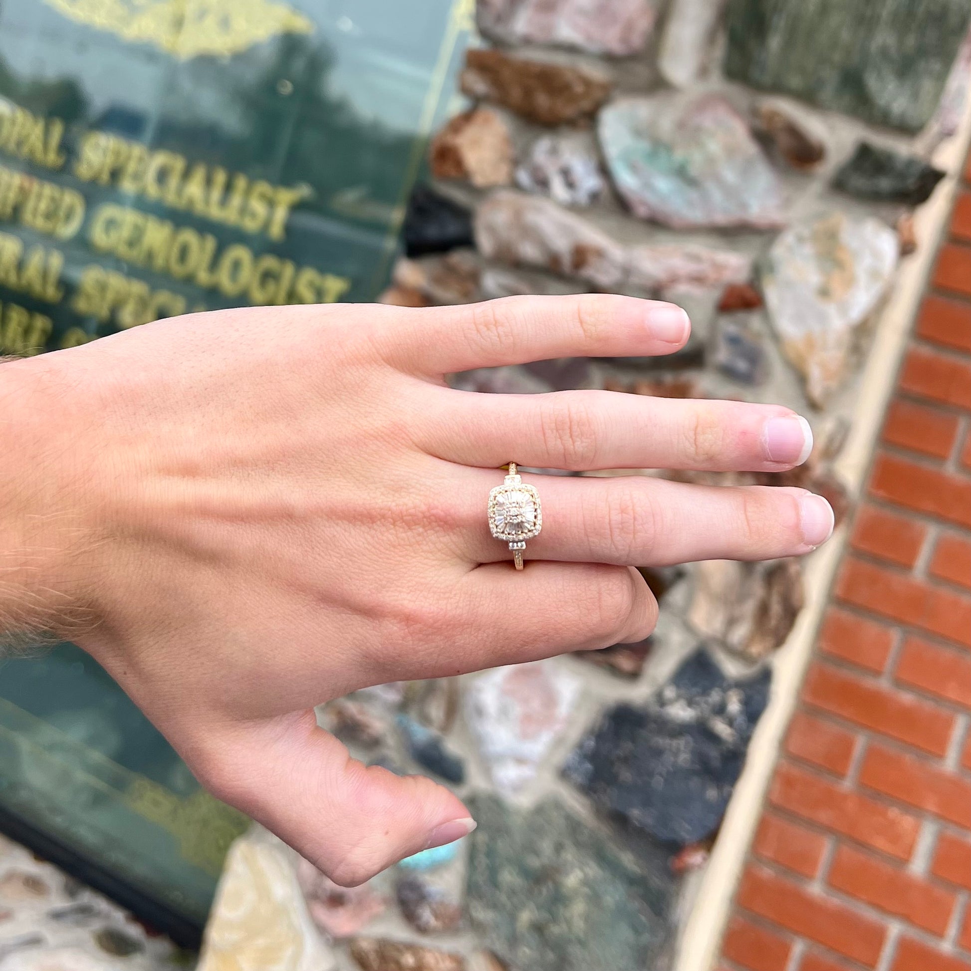 A 1930's style yellow gold diamond cluster ring set with round and baguette cut diamonds.