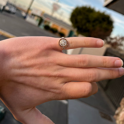 An antique yellow gold ring set with a cluster of old European cut diamonds.