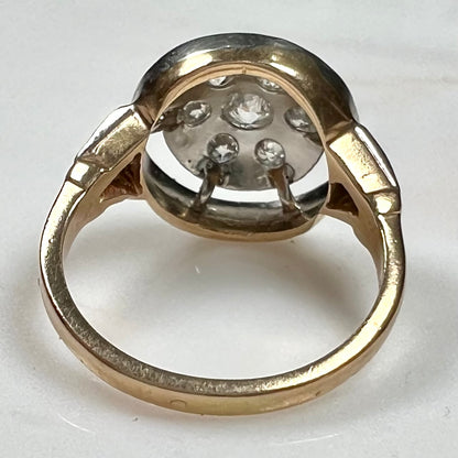 An antique yellow gold ring set with a cluster of old European cut diamonds.