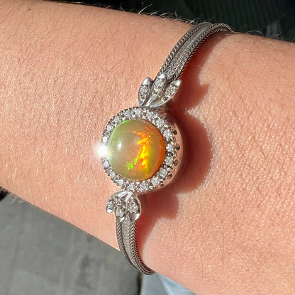 A Virgin Valley fire opal and diamond bracelet made from a vintage 1930's watch.