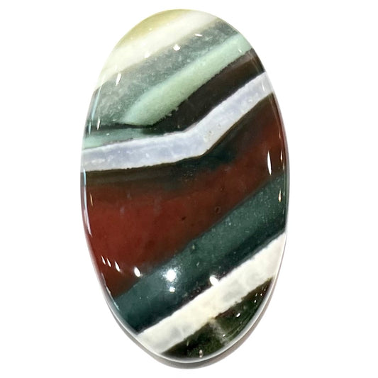 Loose Arizona agate cabochon for sale set on white background.  Stone is striped with red, green, and white.