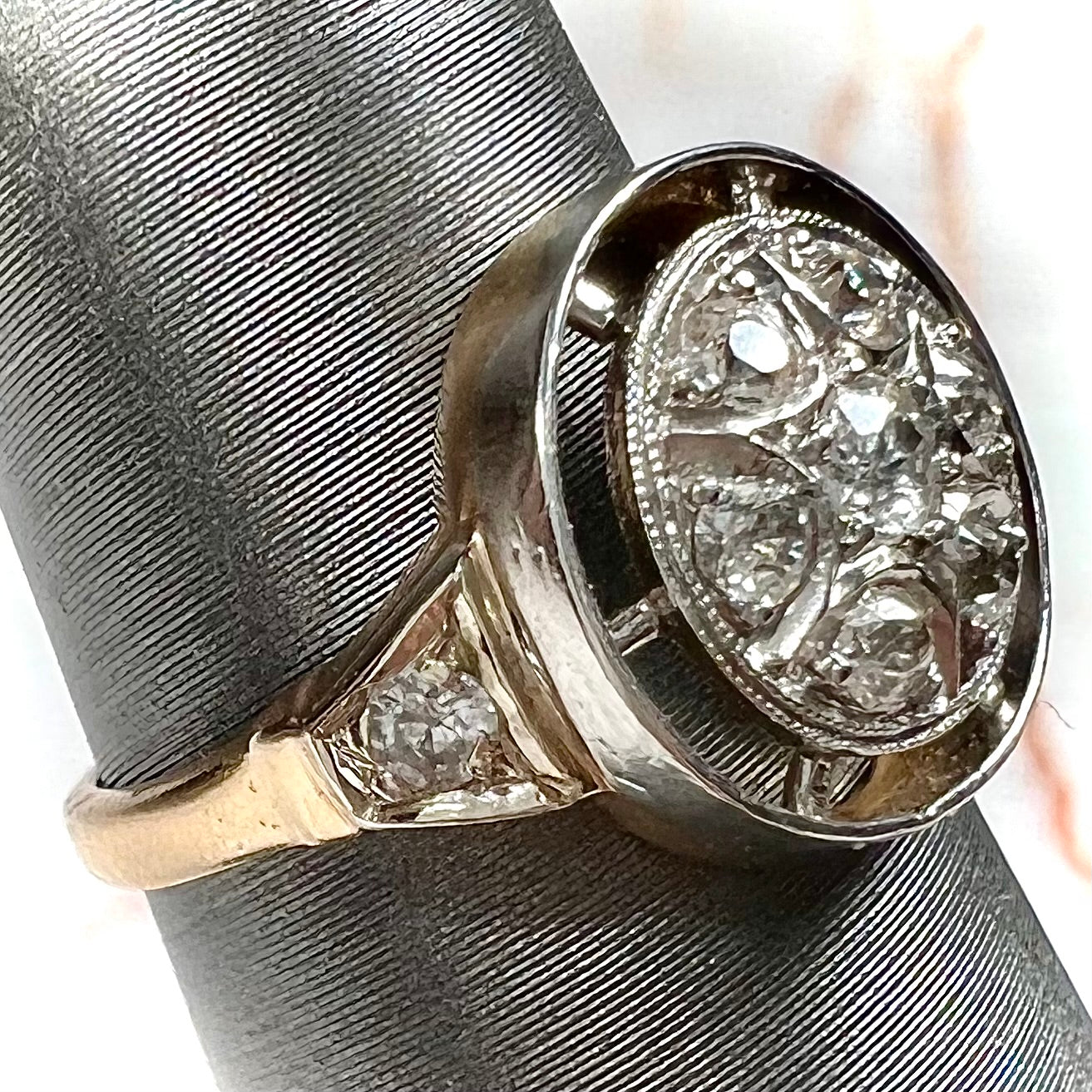 An antique yellow gold ring set with a cluster of old European cut diamonds.