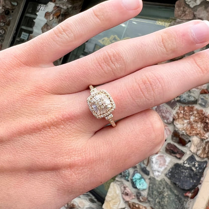 A 1930's style yellow gold diamond cluster ring set with round and baguette cut diamonds.