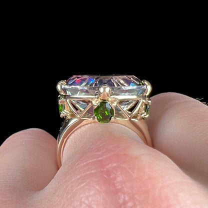 A ladies' large mystic topaz, chrome diopside, and diamond statement ring cast in 14k yellow gold.