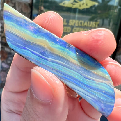 A large, loose, polished Quilpie boulder opal stone from Queensland, Australia.  The stone is blue.