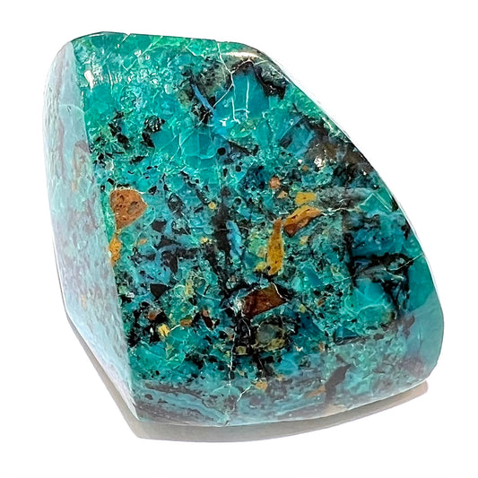 A loose polished chrysocolla specimen that has a crackled effect.