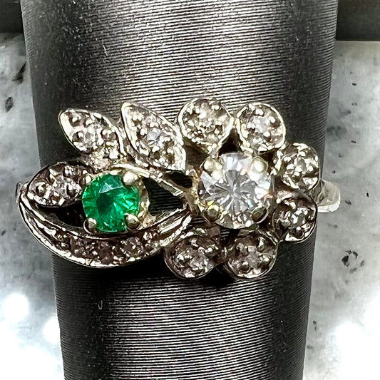 Vintage gold round cut emerald and diamond ring.