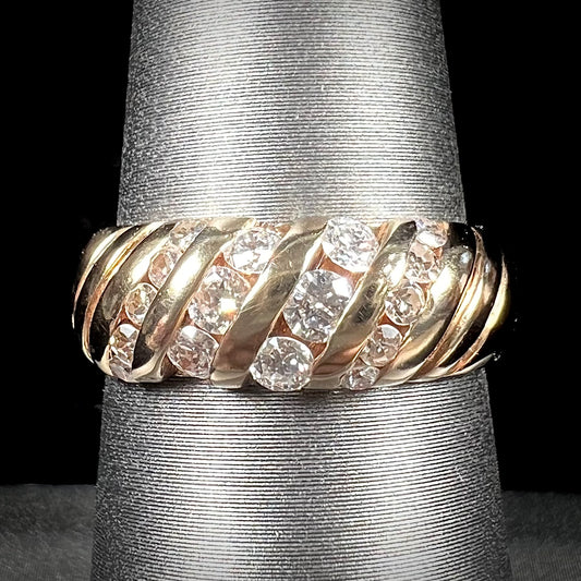 A ladies' channel set gold diamond ring.