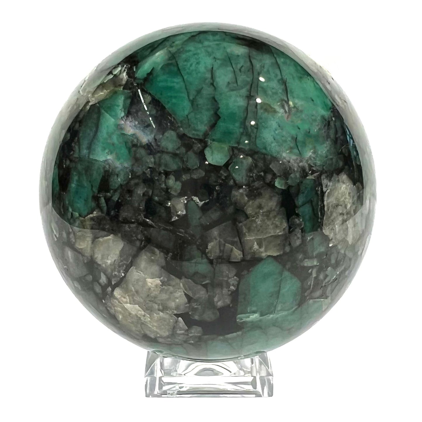 A gemstone sphere carved from a natural emerald crystal specimen, measuring 2.2 inches in diameter.