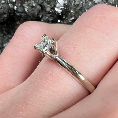 A quarter carat princess cut diamond solitaire engagement ring in white gold.